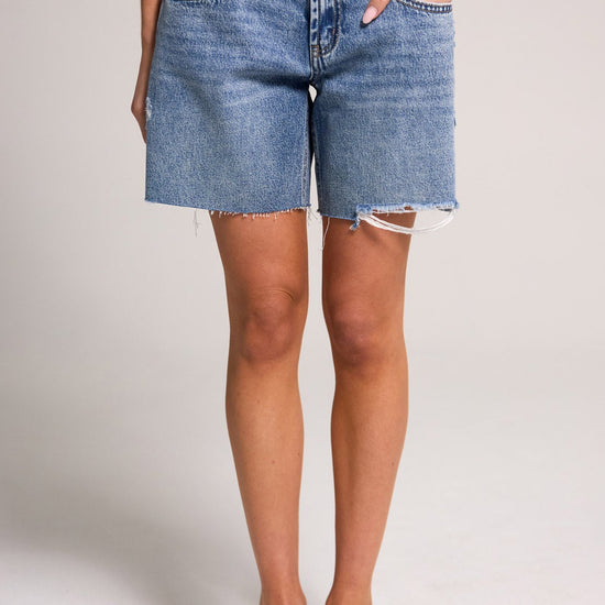 Stylish Belle's Baggy Bermuda Short - Medium Indigo, made of 100% cotton, perfect for casual summer outfits.